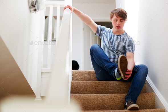 person putting shoe on