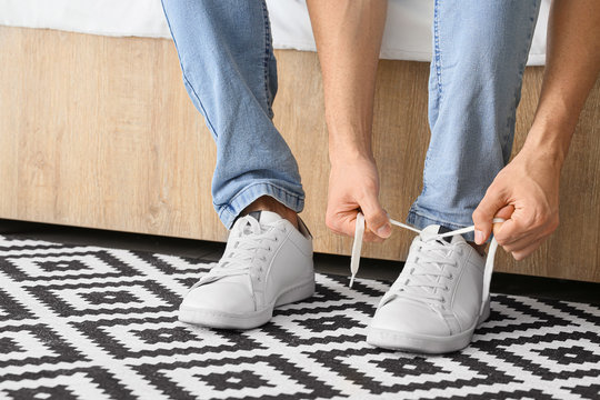 person tying shoe